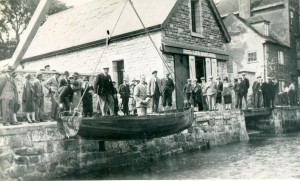Launch of the first Falcon, 'Sparrowhawk', with the owner,  Dr Llewellyn Pridham on board and  Mr Bussell, the designer and builder supervising, 1927